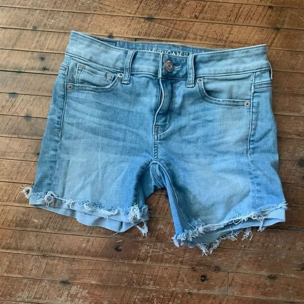 American Eagle distressed raw hem midi 0 denim shorts